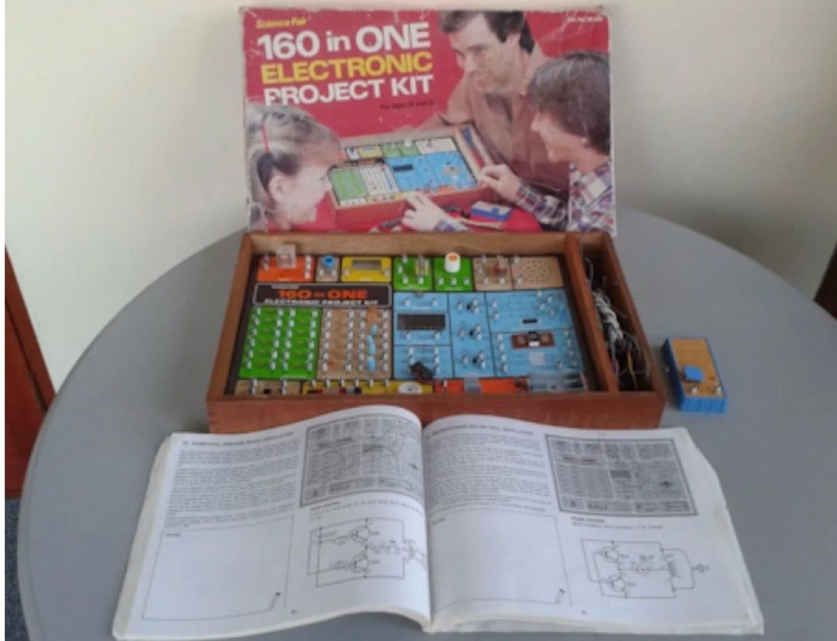 160 in ONE with its lab-type manual open on the table
